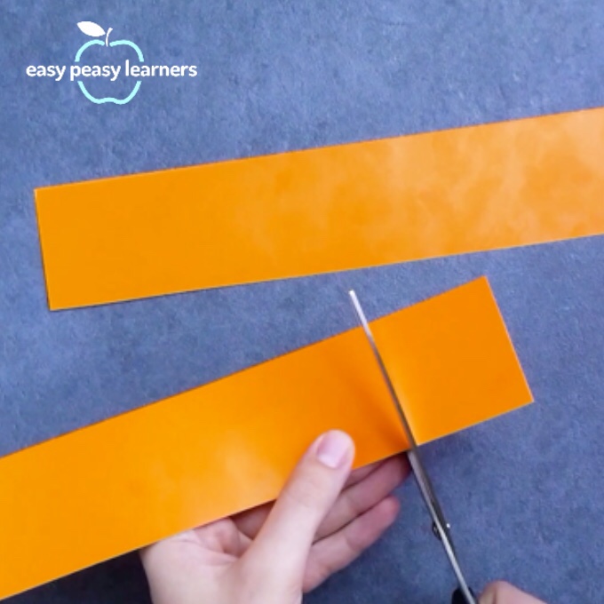 Cutting  cardboard with scissors